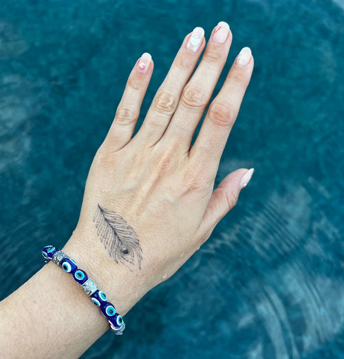 Pluma de pavo real